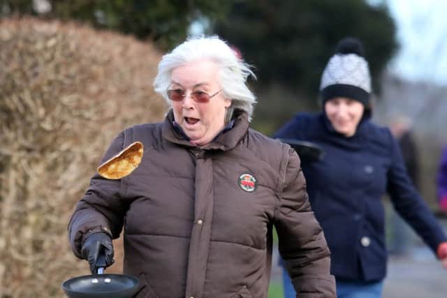 Hazel Pitt, winner of the ladies Caldecott pancake race