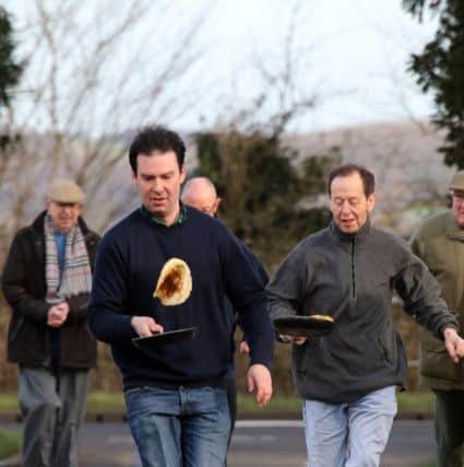 Dan Mort in the lead in the men's Caldecott pancake race