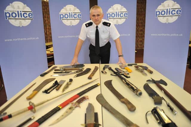 Superintendent Mick Stamper, head of Northampton Operational Command Unit, at Northants Police with some of the knives collected during a recent knife amnesty.