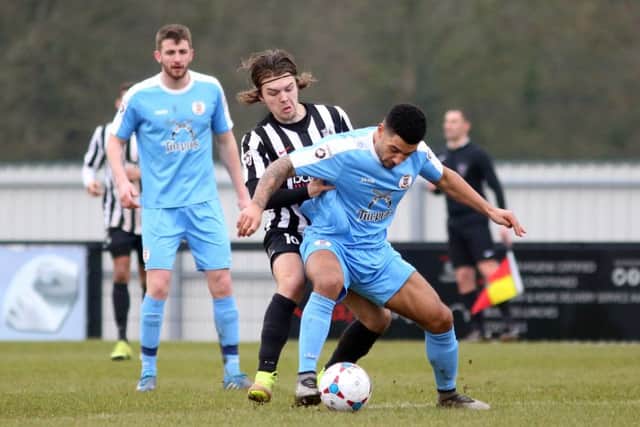 Ben Milnes battles for possession during Corby's win over Tamworth