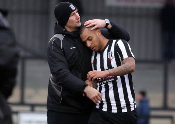 Corby Town boss Tommy Wright congratulates goalscorer Greg Mills after the Steelmen completed a 2-0 win over Tamworth. Pictures by Alison Bagley