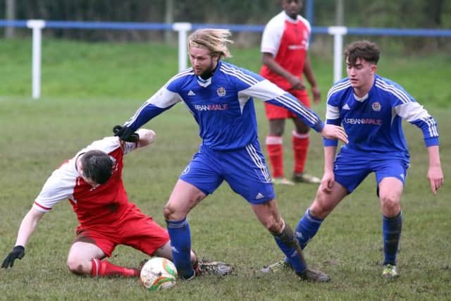 Action from Thrapston Town's 1-1 draw with Woodford United