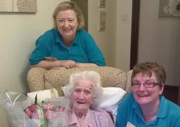 Mary Burdett celebrating her 102nd birthday with Kath Meredith & Sharon Rock at Cando Care in Raunds