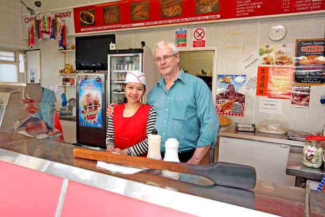 Olympic Fish Bar owners Kam Fung Tsang and husband Ray Critchlow fought off two robbers with a curry paddle called 'Woody'. NNL-140221-150338009