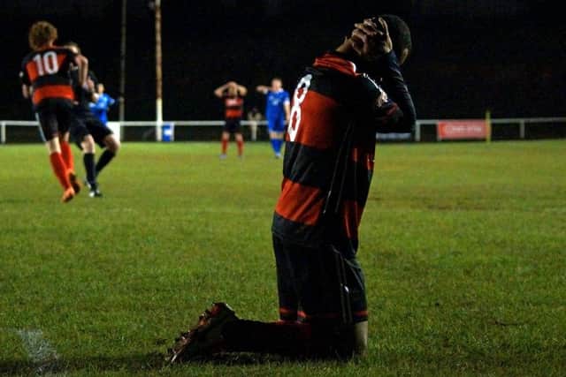 Spencer Weir-Daley's reaction after a missed chance summed up the overall mood for Kettering Town as they drew 1-1 with Frome Town at Latimer Park. Pictures by Peter Short