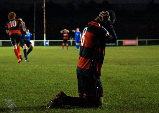 Spencer Weir-Daley's reaction after a missed chance summed up the overall mood for Kettering Town as they drew 1-1 with Frome Town at Latimer Park. Pictures by Peter Short