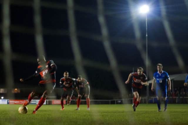 Wilson Carvalho scores from the penalty spot to give the Poppies the lead
