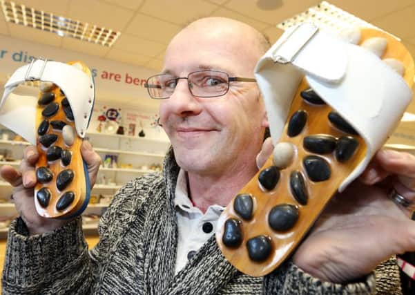 Peter Smith, who volunteers at Corbys Cancer Research charity shop, is to walk around Corby town centre for an hour on February 27 wearing the uncomfortable reflexology shoes