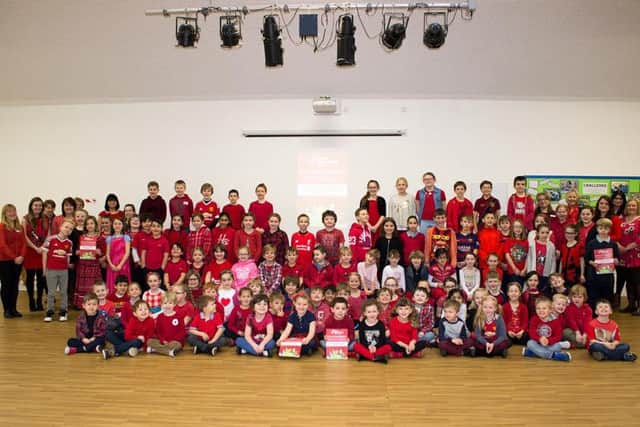 Pupils in red at Rushton Primary School.