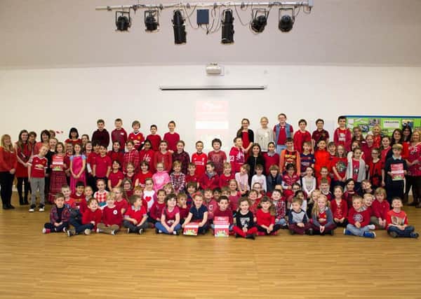 Pupils in red at Rushton Primary School.
