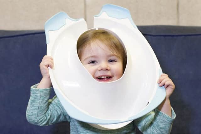 Daisy Dempsey got her toilet training seat stuck on her head