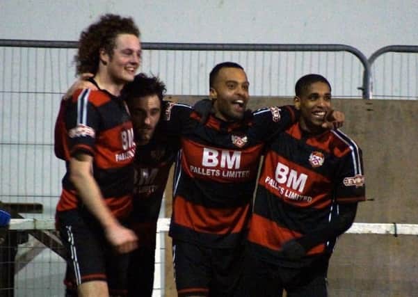 Spencer Weir-Daley (second from right) celebrates with his Kettering Town team-mates after scoring his second goal in two games on Tuesday. Pictures by Peter Short
