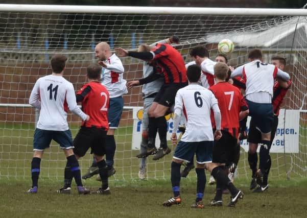 Action from the 2-2 draw between ON Chenecks and Raunds Town last weekend