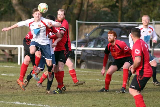 Action from Stewarts & Lloyds' 2-1 home defeat to ON Chenecks in Division One
