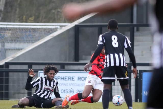 Anton Brown brings down Tyrell Waite in the incident that led to Nuneaton Town's Elliott Whitehouse scoring his team's third goal from the penalty spot
