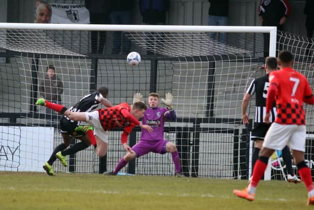 Joe Ironside heads home Nuneaton Town's second goal at Steel Park