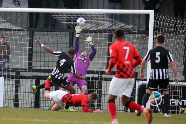 Steelmen goalkeeper Sam Donkin is beaten by Joe Ironside's header during the 3-1 loss to Nuneaton Town on Saturday. Picture by Alison Bagley