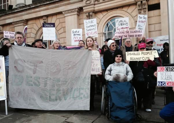 Members of the public, union members and service users protested against the planned Â£65m worth of cuts to the county council outside County Hall last week.