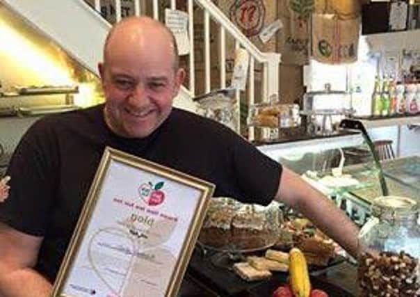 Kafe Bloc owner Tony Bagshaw with the award