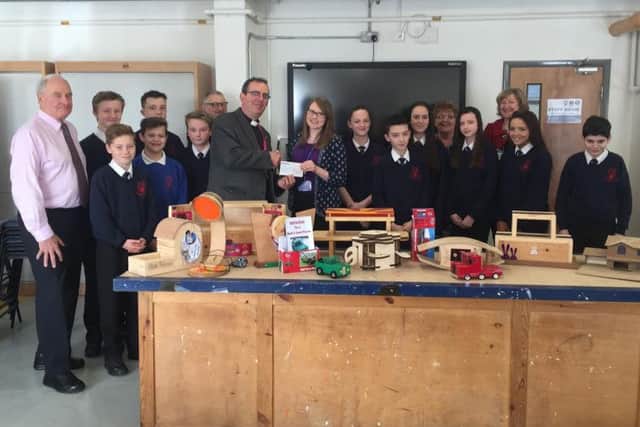 Revd Richard Coles presenting the cheque to Katie Campbell at Huxlow