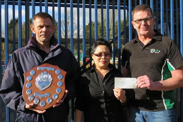 A total of Â£200 raised at the Barry Scholes Memorial Shield event in Corby has been handed over to the Lakelands Hospice