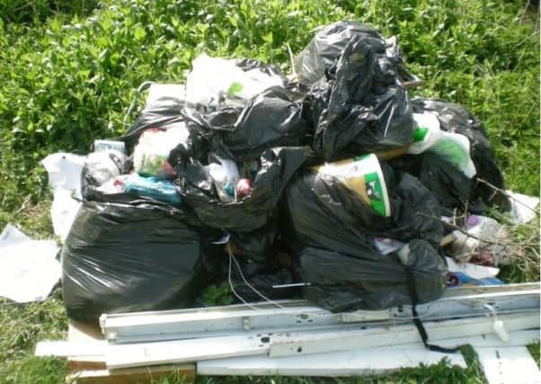 The fly-tipped waste at Ditchford Lakes car park