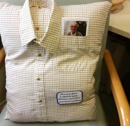 The cushion made from John Beckett's shirt. Picture: SWNS