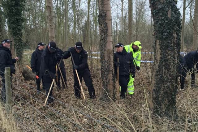Police searching woods near Warkton this morning