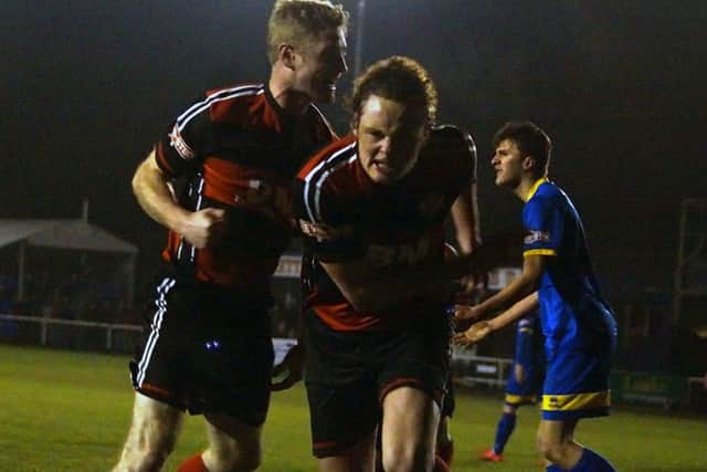 Liam Canavan heads off to celebrate after he opened the scoring for Kettering Town late on against Paulton Rovers. Pictures by Peter Short