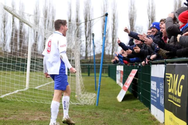 Elliot Sandy celebrates with the Diamonds fans after his goal brought them level at 1-1