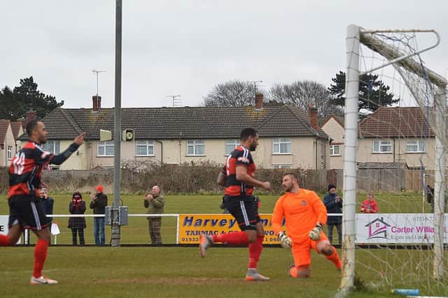 Spencer Weir-Daley and Rene Howe celebrate after Will Grocott's volley found the St Neots Town net to give Kettering Town their equaliser in the 1-1 draw. Picture by Jim McAlwane