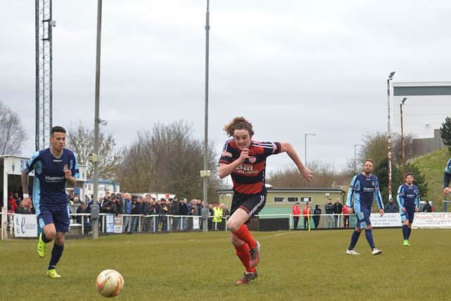 Liam Canavan goes on a run during Kettering Town's 1-1 draw with St Neots Town at Latimer Park