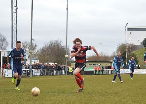 Liam Canavan goes on a run during Kettering Town's 1-1 draw with St Neots Town at Latimer Park