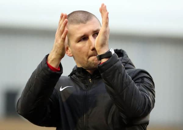 Tommy Wright is staying at Corby Town after he considered his position following the 3-0 defeat at AFC Telford United