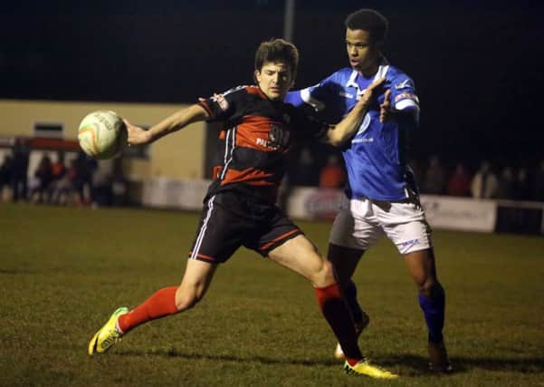 David Popa holds of a Stratford Town defender during Kettering Town's 3-1 win at Latimer Park. The youngster, who is on loan from Birmingham City, opened the scoring on his full debut. Pictures by Alison Bagley