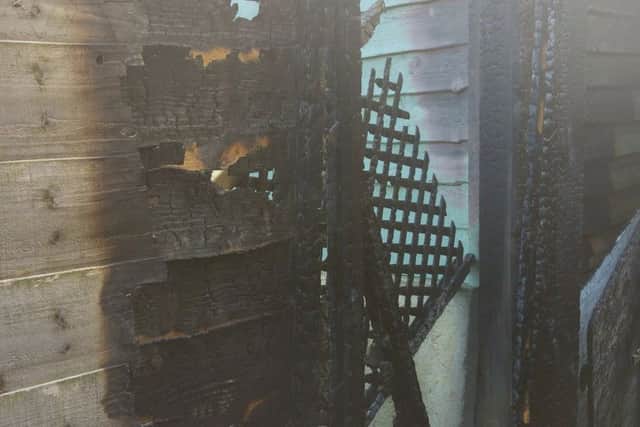 Part of the fence damaged by fire in Higham Ferrers