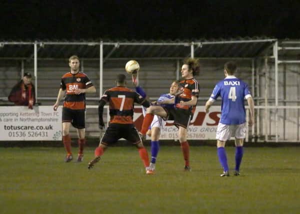Gary Mulligan watches on as Liam Canavan battles for possession during Kettering Town's midweek win over Stratford Town