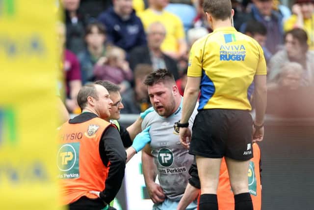 Kieran Brookes was withdrawn during the first half after colliding with Ashley Johnson's knee (pictures: Sharon Lucey)