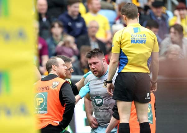 Kieran Brookes was withdrawn during the first half after colliding with Ashley Johnson's knee (pictures: Sharon Lucey)