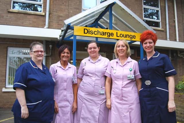 The discharge lounge team outside their new unit at KGH