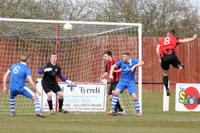 Joe Chubb heads home Raunds Town's goal during last weekend's 1-1 draw with Lutterworth Athletic in UCL Division One. Picture by Alison Bagley