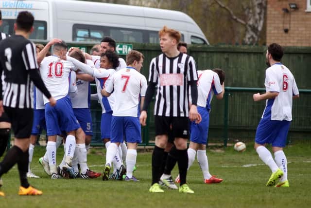 The AFC Rushden & Diamonds players celebrate after Liam Dolman scored their goal against Hanwell