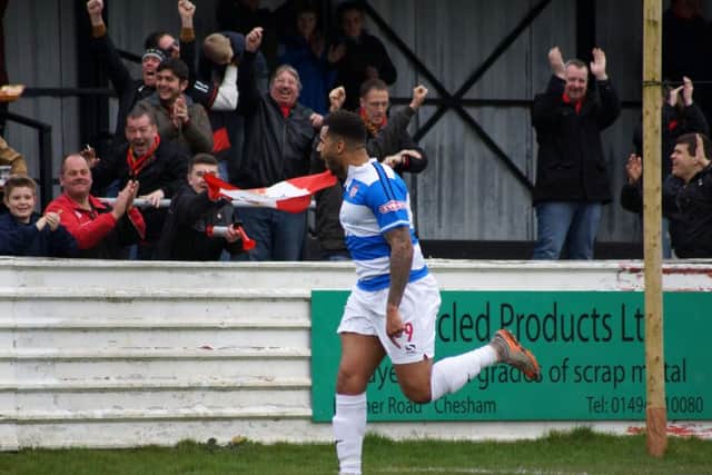 Rene Howe celebrates in front of the travelling Poppies fans after his goal at Chesham