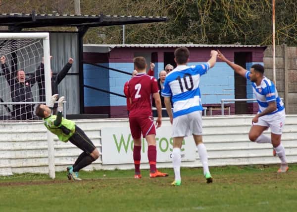 Rene Howe scores Kettering Town's first goal during the 3-0 success at Chesham United. Pictures by Peter Short