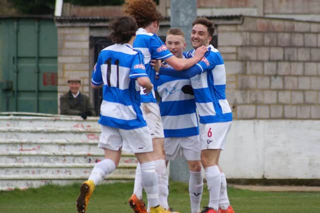 Ben Baker takes the congratulations after scoring his first league goal for Kettering