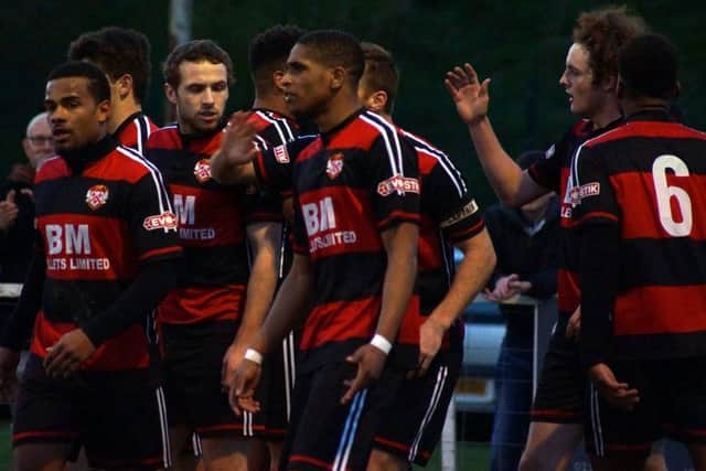 The Kettering Town players celebrate after Liam Canavan's goal in the 1-1 draw with Leamington at Latimer Park. Pictures by Peter Short