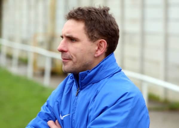 Wellingborough Town boss Jon Mitchell is remaining confident about his team's chances of avoiding the drop