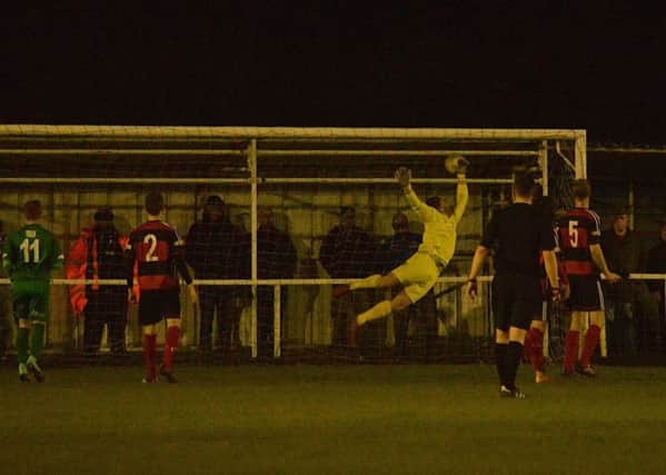 Luke Rowe's free-kick beats Kettering Town goalkeeper Craig Hill for the only goal at Latimer Park as Bedworth United claimed a shock 1-0 success. Picture by Jim McAlwane UFXhxTg23L7aYDARTIxJ