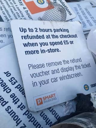 Smart Parking signs dumped in a skip at Co-op in Corby NNL-160415-140254001