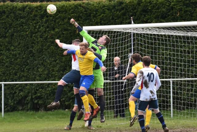 Action from promotion-chasing ON Chenecks' 2-0 win over Potton United last weekend